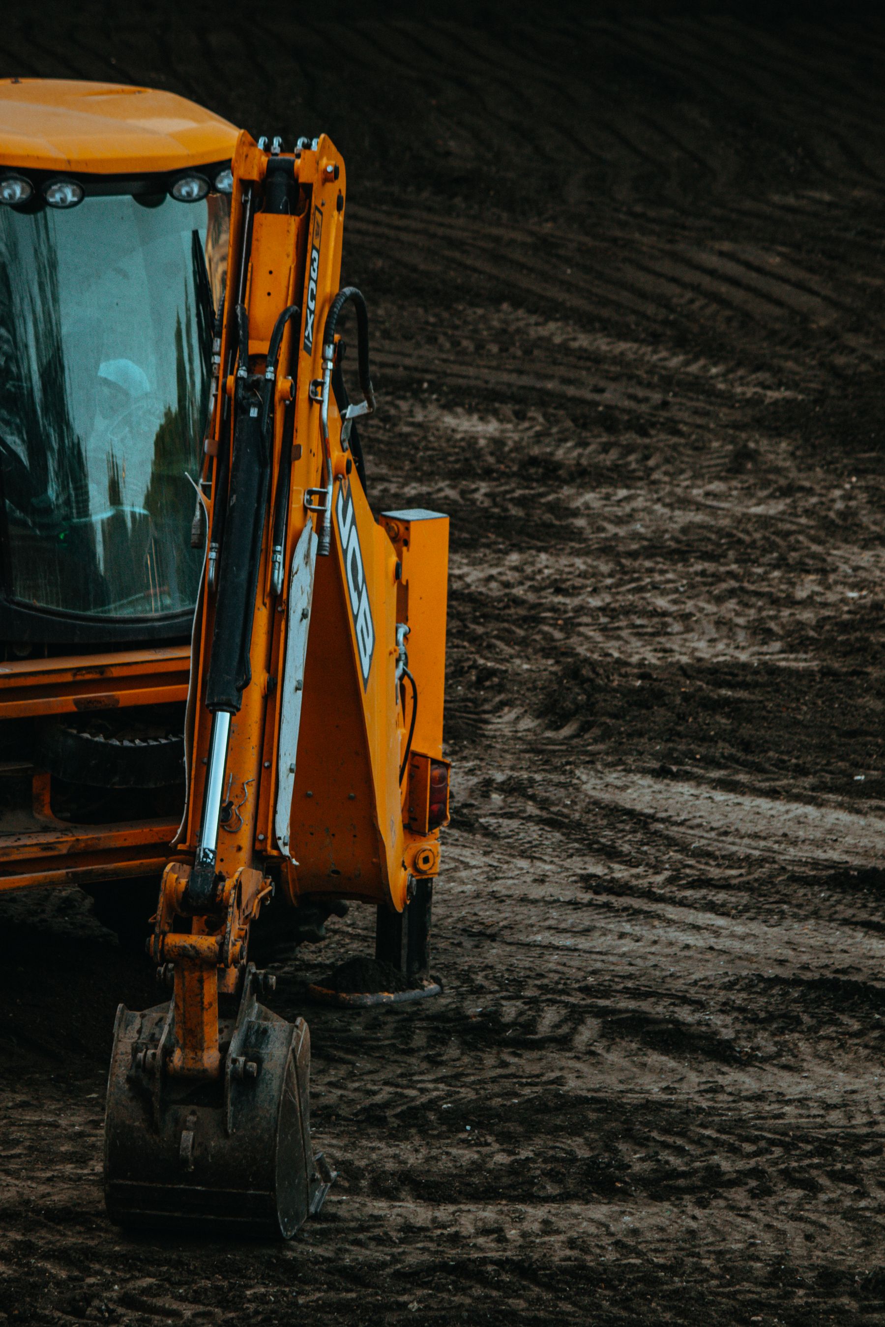 Excavator working on a muddy site