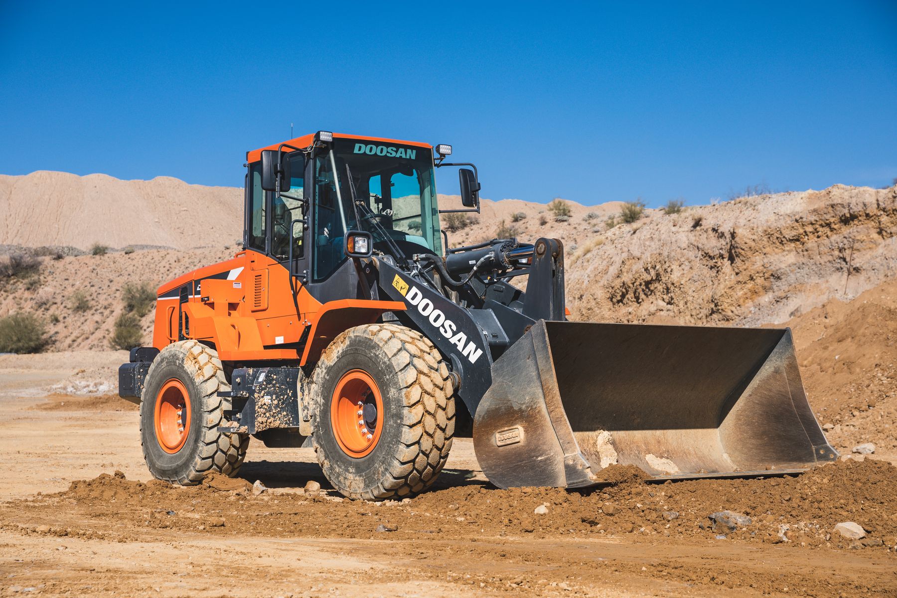 Excavator working on a rural earthwork site